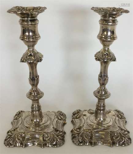 A pair of Victorian silver candlesticks with shape