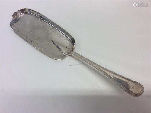 An Edwardian bright cut silver crumb scoop attract