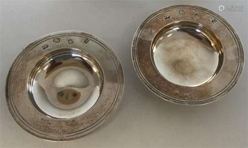 A pair of small silver Armada dishes of typical de