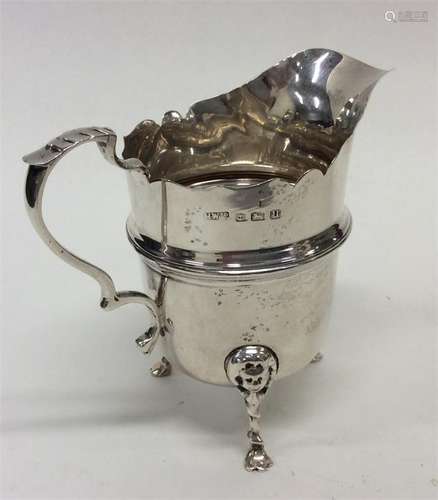 A small Edwardian silver helmet-shaped cream jug w