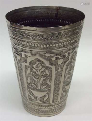 A Continental silver beaker decorated with flowers