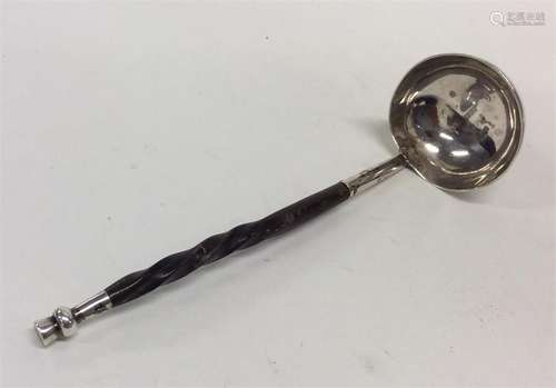 A small Victorian silver toddy ladle with whalebon