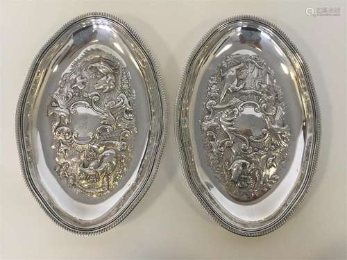 A good pair of oval silver embossed sweet dishes w