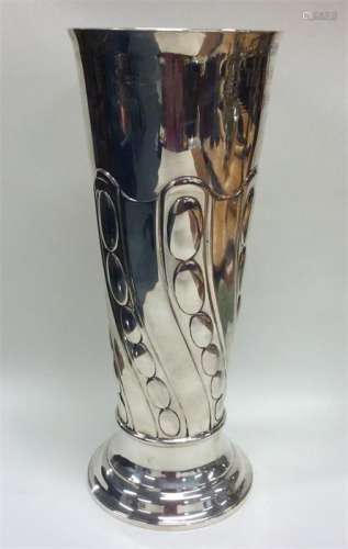 A massive silver tapering spill vase with swirl de