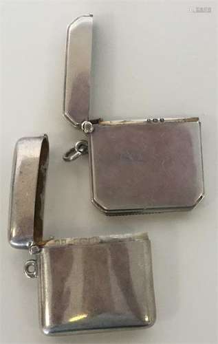 An Art Deco plain silver vesta case with cut corne