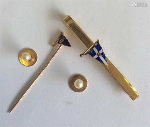 A 9 carat Naval tie clip together with matching st