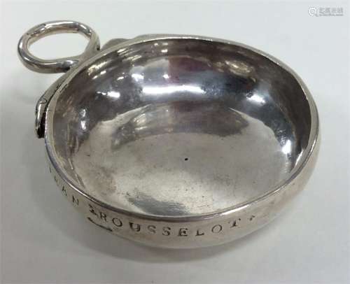 An early silver bleeding bowl with serpent handle.