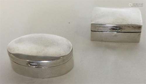 Two modern silver hinged top pill boxes. Approx. 1