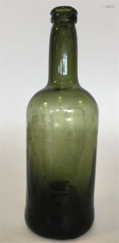 An early 19th Century green glass wine bottle. App