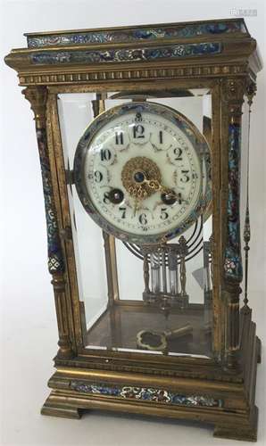 An attractive brass and enamelled striking clock w