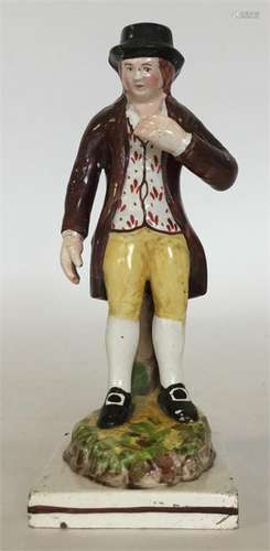 An Enoch Wood Staffordshire figure modelled as a ma