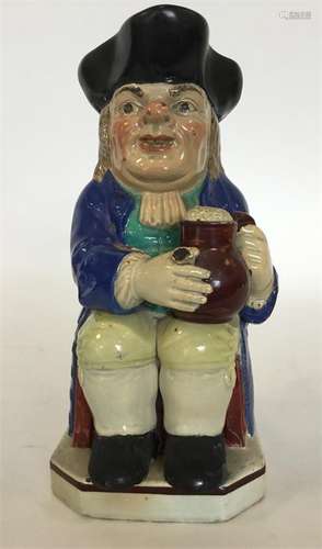 A Staffordshire Enoch Wood toby jug modelled as a