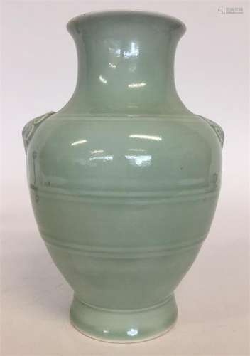 A Chinese celadon-ground oviform vase with moulded