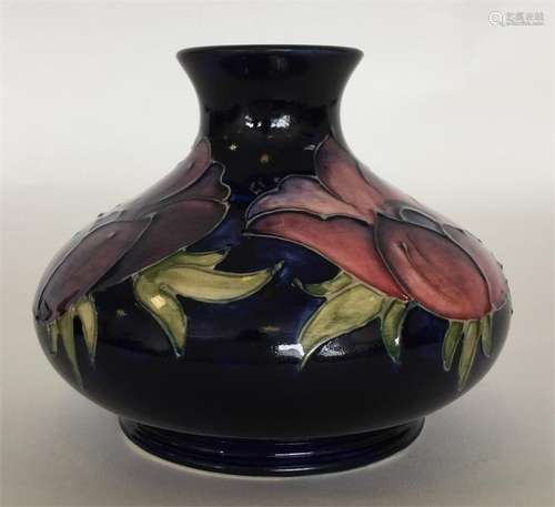 MOORCROFT: A small blue-ground oviform vase decora