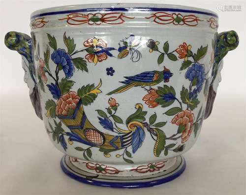 A Continental tin-glazed jardiniere with mask head