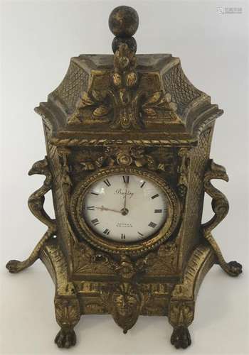 A brass mounted clock fitted with a Verge movemen