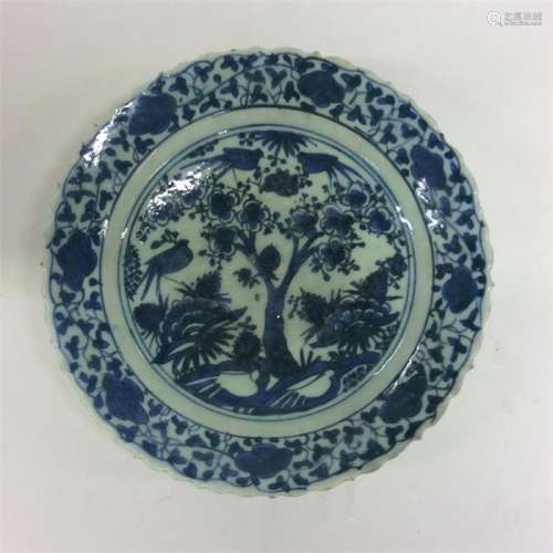 A Persian pottery blue and white saucer dish with