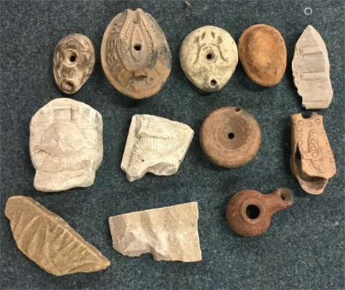 A group of ancient stoneware bottles and figures.