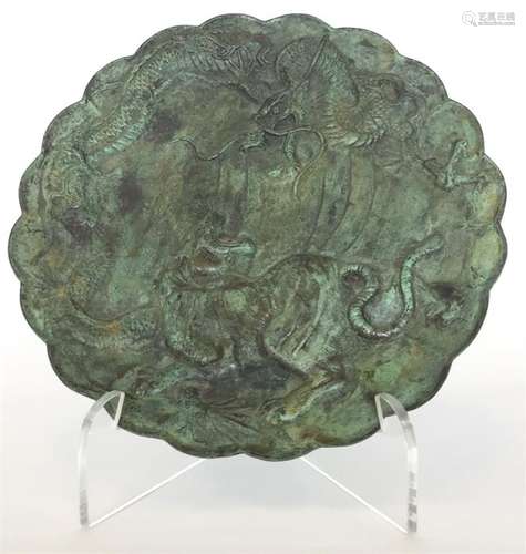 A Chinese bronze dish with shaped rim modelled wit