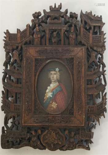 An ornately carved miniature of a gentleman of tit