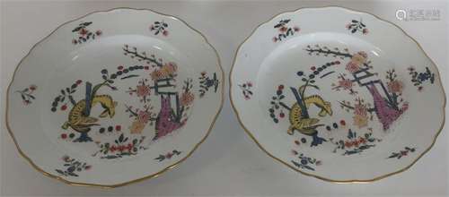 A pair of Meissen porcelain shallow plates painted