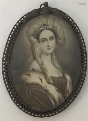 An oval miniature of a lady in brass pierced frame