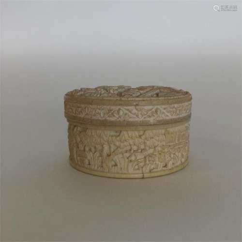 A good quality carved ivory cylindrical box with v