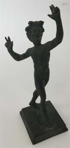 A brass statue in the form of a fawn in standing p