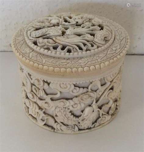 A good Antique carved ivory cylindrical box with l