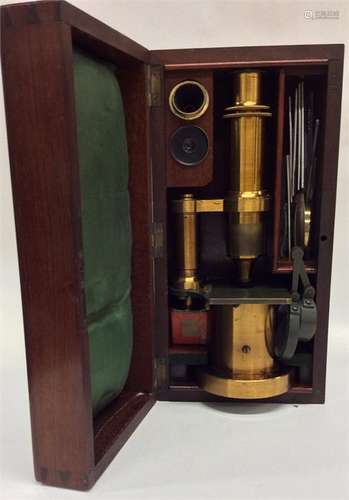 A good quality mahogany cased microscope complete