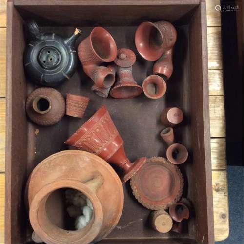 A group of terracotta pipes together with vases et
