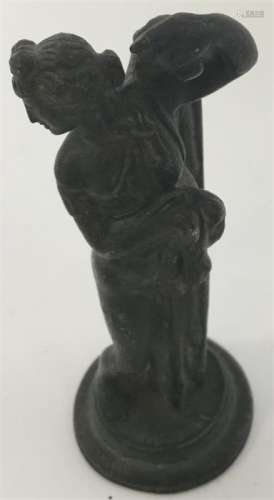 A bronzed figure of a semi-naked lady with outstre