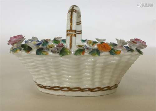 A 19th Century English porcelain basket heavily en