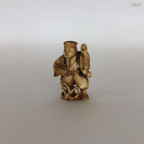 A carved ivory netsuke in the form of an Oriental