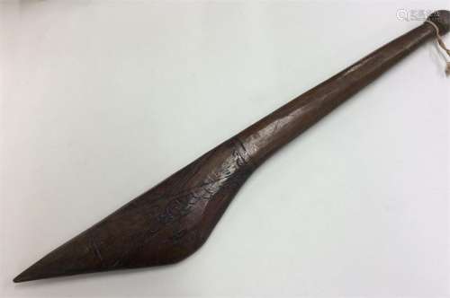 A carved tribal spear etched with stars. Approx. 5