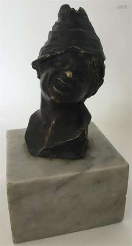 A large heavy bust of a child with hat on square m