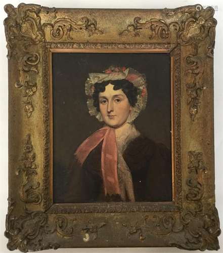 A gilt framed portrait of a lady wearing a bonnet.