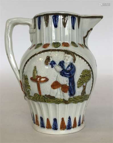 A Yorkshire pratware oviform jug moulded and paint