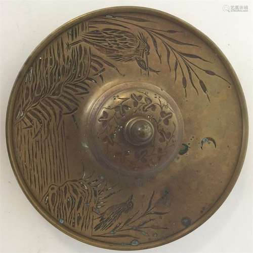 A brass aesthetic inkwell decorated with birds and