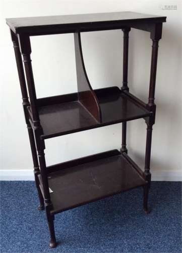 An Edwardian mahogany book stand on turned spreadi