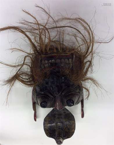 An unusual tribal mask with lacquer decoration mou