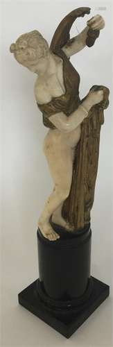 A good quality ivory and brass mounted statue of a