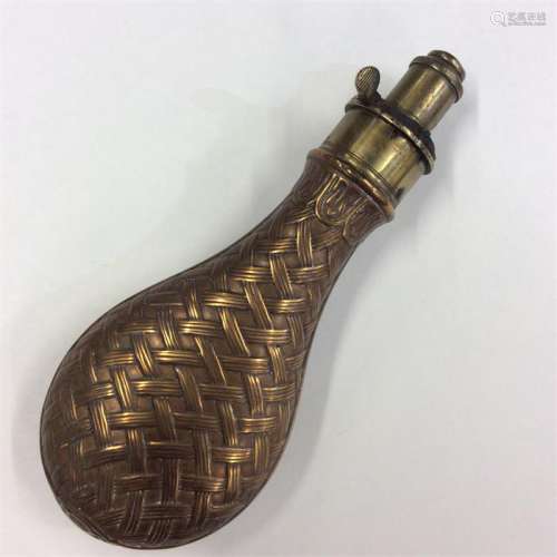 A textured brass-mounted shot flask with weave wor