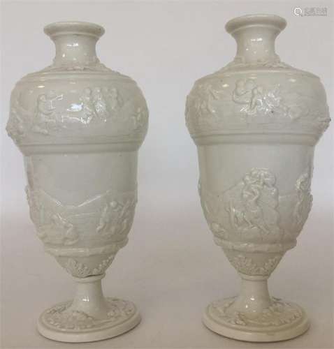 A pair of Doccia white-glazed vases, the sides mou