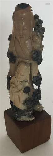 A Chinese soapstone finely carved figure modelled