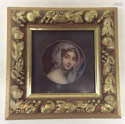 A small circular miniature of a young lady with bl