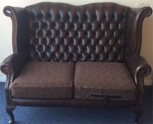 A good button-back leather two seater settee on ca