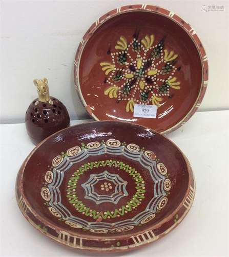 A Continental pottery circular dish, slip decorated