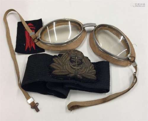 A pair of World War II flying goggles together wit