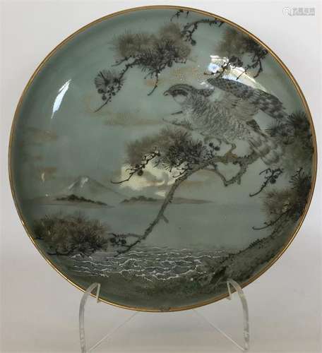 A Japanese circular shallow dish painted with a bi